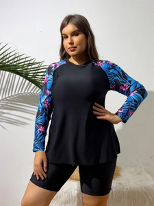 Detail of floral printed raglan sleeves on women's long sleeve surf tankini set