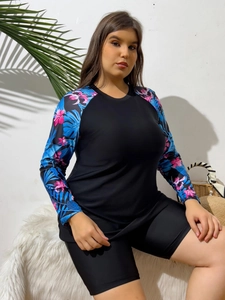 Detail of plus size long sleeve rash guard with tropical palm leaf and flower prints
