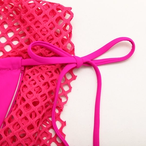 Close-up of rose red mesh fabric and adjustable side tie on the three-piece bikini set