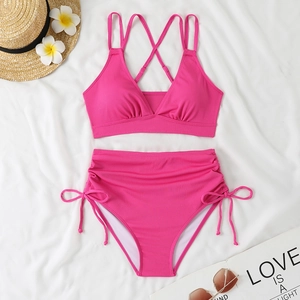 Detailed flat lay of fuchsia ribbed bikini set with drawstring high waist bottom