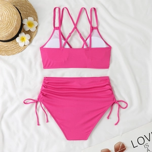 Detailed view of rose pink high waisted bikini set with drawstring side and ribbed texture