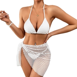 Three-piece white mesh bikini set with halter top and asymmetrical cover-up skirt