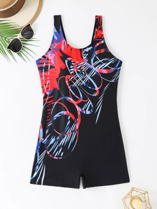 Flat lay of sporty one-piece swimsuit with abstract prints and beach accessories