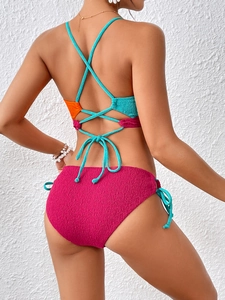 Detail of cross-back tie design on high-texture contrast color bikini set for women