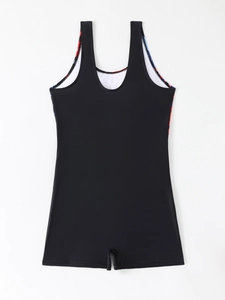 Detail of athletic boy-leg swimsuit featuring vibrant geometric pattern side panels