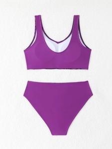 Flat lay of purple two-piece bikini set with padded top and high-waisted bottom