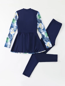 Close-up of modest long-sleeved floral top and navy blue leggings swimwear set