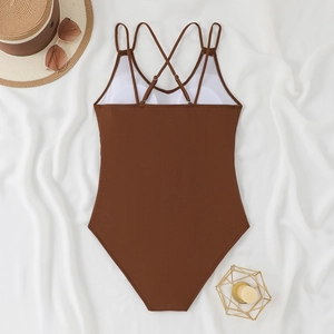 Detailed back view of brown ribbed swimsuit with multi-strap crisscross open back design