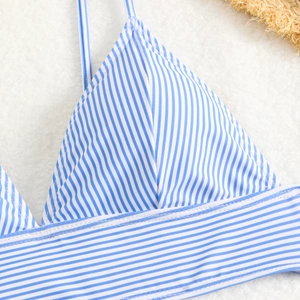 Detail of blue and white striped bikini top with double stitching and fine straps