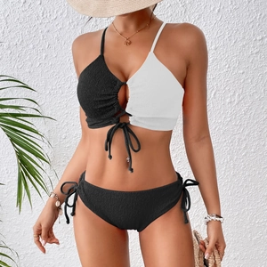 Two-piece color block bikini with ribbed fabric and one-shoulder lace-up design