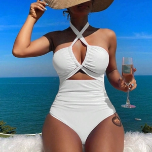 Elegant white halter neck one-piece swimsuit with cross-front cutout and ruched detailing