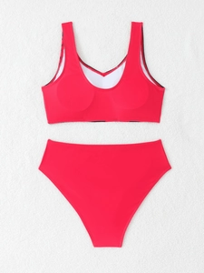 Detailed flat lay of red two-piece bikini set with high waist bottom and crop top