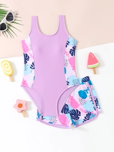 Costume da bagno due pezzi per bambina con motivi tropicali e top a canotta viola