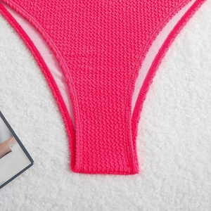 Detailed macro view of the hot pink crinkle textured fabric and neat stitching detail