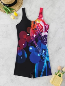 Close-up of one-piece swimsuit featuring abstract colorful prints and U-neckline detail