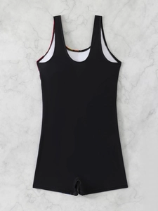Flat lay of women's black one-piece boyleg swimsuit with colorful printed neckline trim
