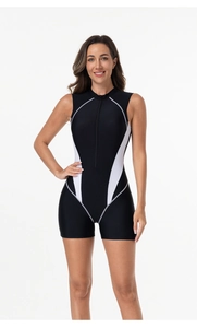Close-up of black and white color-block one-piece swimsuit with front zipper and stand collar
