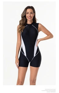Close-up of front zipper detail on black and white sleeveless athletic surfing swimsuit