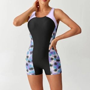 Detail of athletic one-piece swimsuit with tropical print side panels and racerback