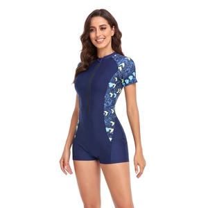 Close-up of short sleeve surfing swimsuit featuring front zipper and geometric print