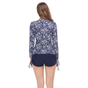 Back view of long-sleeve floral bikini top and boyleg swim shorts with side drawstring