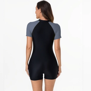 Rear view of women's short sleeve one-piece swimsuit in black and grey-blue patchwork