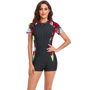 Close-up of front zipper and athletic letter print on women's short sleeve surfing swimsuit