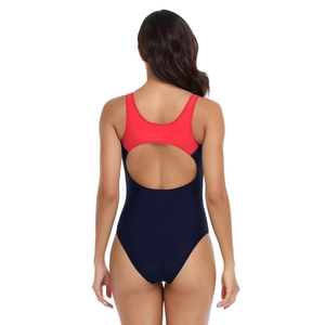 Detail view of the open-back cutout on red and blue high-stretch athletic swimsuit