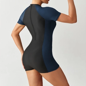 Close-up of women's athletic surfing swimsuit featuring a back zipper and contrast panels