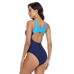 Detail of blue athletic one-piece swimsuit featuring wide straps and ergonomic open back