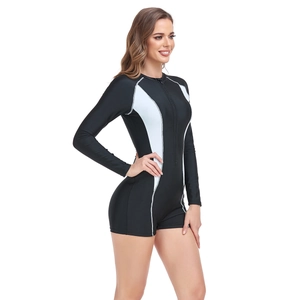 Detail of long-sleeved one-piece swimsuit with front zipper and side color blocking