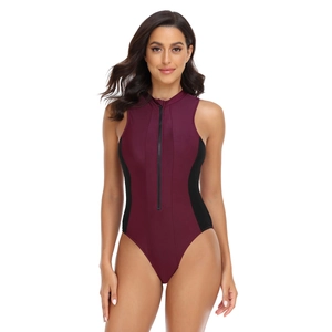 Detail of burgundy one-piece swimsuit with black side panels and front zipper closure