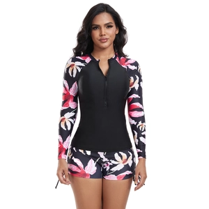 Detailed front view of long sleeve floral surfing swimsuit with front zipper closure