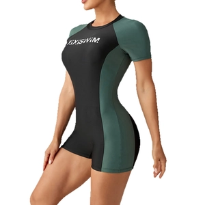 Women's long sleeve one-piece surfing swimsuit in black and dark green color block design
