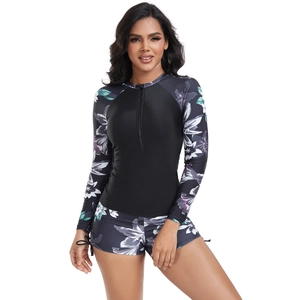 Detail of floral print on long sleeve surfing suit with functional front zipper