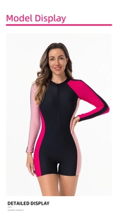 Close-up of long sleeve surfboard swimsuit featuring contrast side panels and front zipper