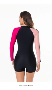 Rear view of long sleeve rash guard with black body and contrast pink sleeves