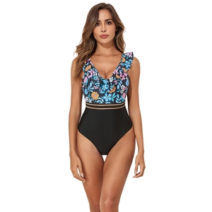 Detail of floral V-neck ruffled bodice and black mesh stripe on one-piece swimsuit