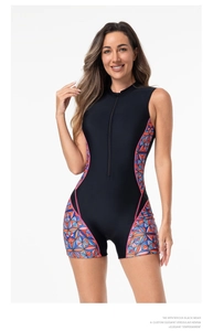 Detail view of athletic one-piece swimsuit featuring front zipper and geometric pattern