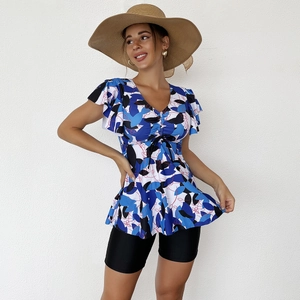 Detail of floral V-neck tankini top with flutter sleeves and black boyshort bottoms