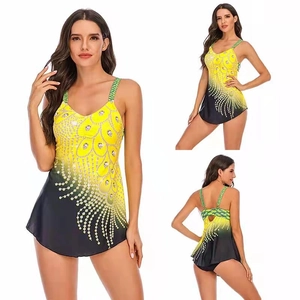 Detail view of plus size tankini featuring yellow feather print and braided straps