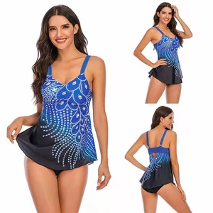 Detail view of plus size tankini set with blue gradient feather print and black bottoms