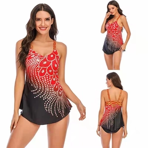 Three-view display of a plus size tankini with red gradient and peacock feather print