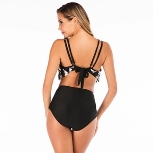 Detail of two-piece bikini featuring double straps and back bow-tie knot on printed top