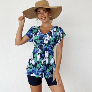 Detail of floral V-neck tankini top with ruffled sleeves and high waisted swim shorts