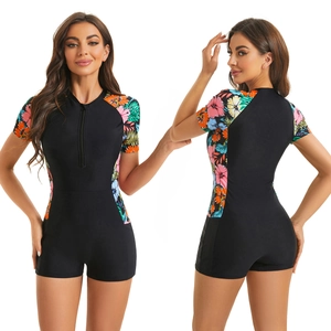 Front and back views of women's one-piece swimsuit with tropical floral prints and zipper