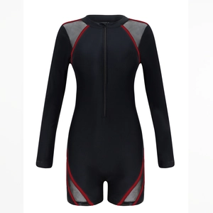 Detail of long sleeve surfboard swimsuit featuring red trim and gray mesh panels