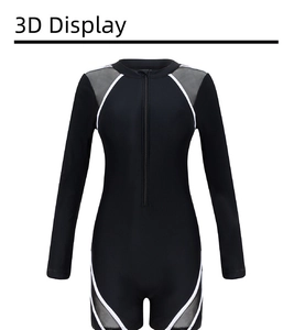 Close-up of black long sleeve swimsuit featuring front zipper and grey mesh details