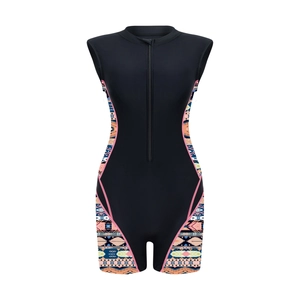 Detailed view of women's one-piece athletic swimsuit with tribal print and front zipper