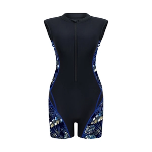 Close-up of a black one-piece swimsuit with tropical leaf print and front zipper detail